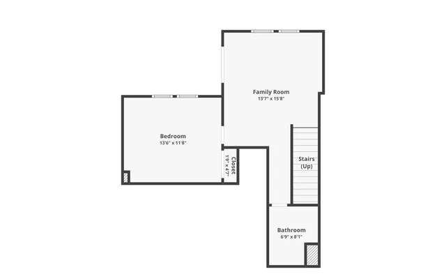 a picture of a bathroom with a white wall