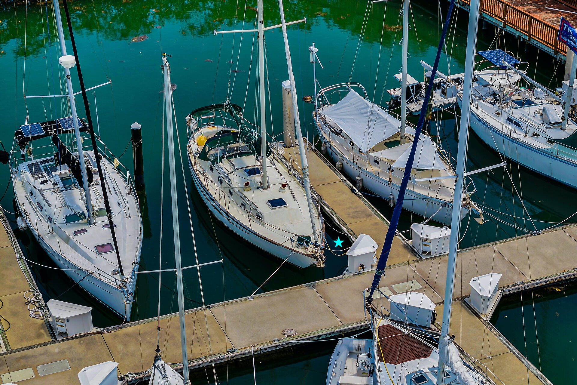 5555 College Road, Unit STARFISH 6 Key West, FL 33040 - Photo 5 of 21 a view of deck with patio table and chairs
