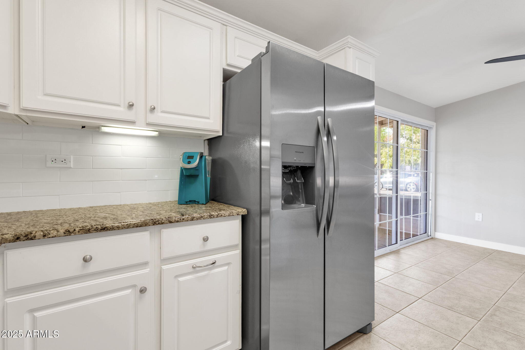 343 West Montecito Avenue Phoenix, AZ 85013 - Photo 16 of 39 a kitchen with granite countertop a cabinets and refrigerator