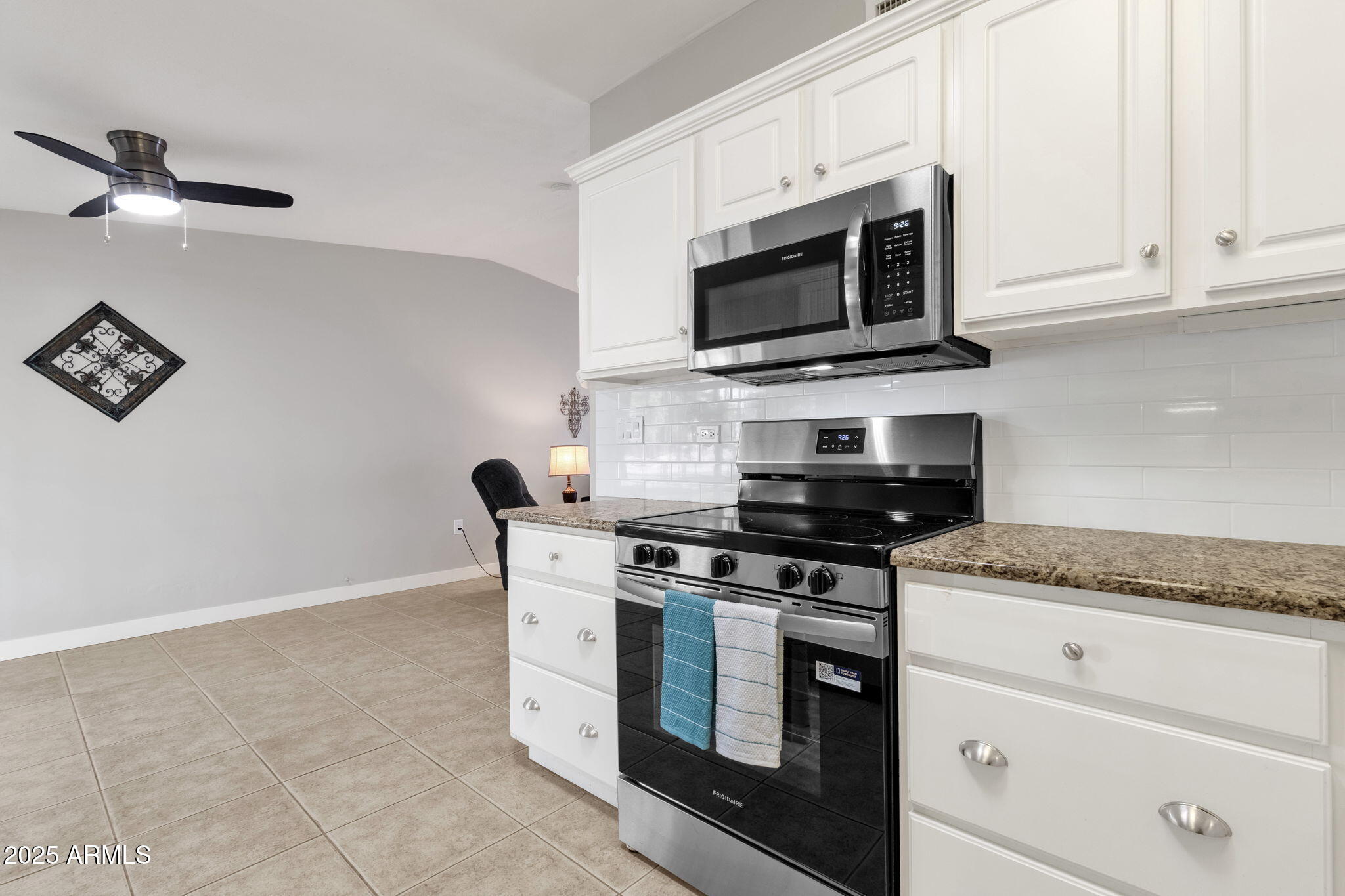 343 West Montecito Avenue Phoenix, AZ 85013 - Photo 17 of 39 a kitchen with stainless steel appliances granite countertop white cabinets a microwave oven and a sink