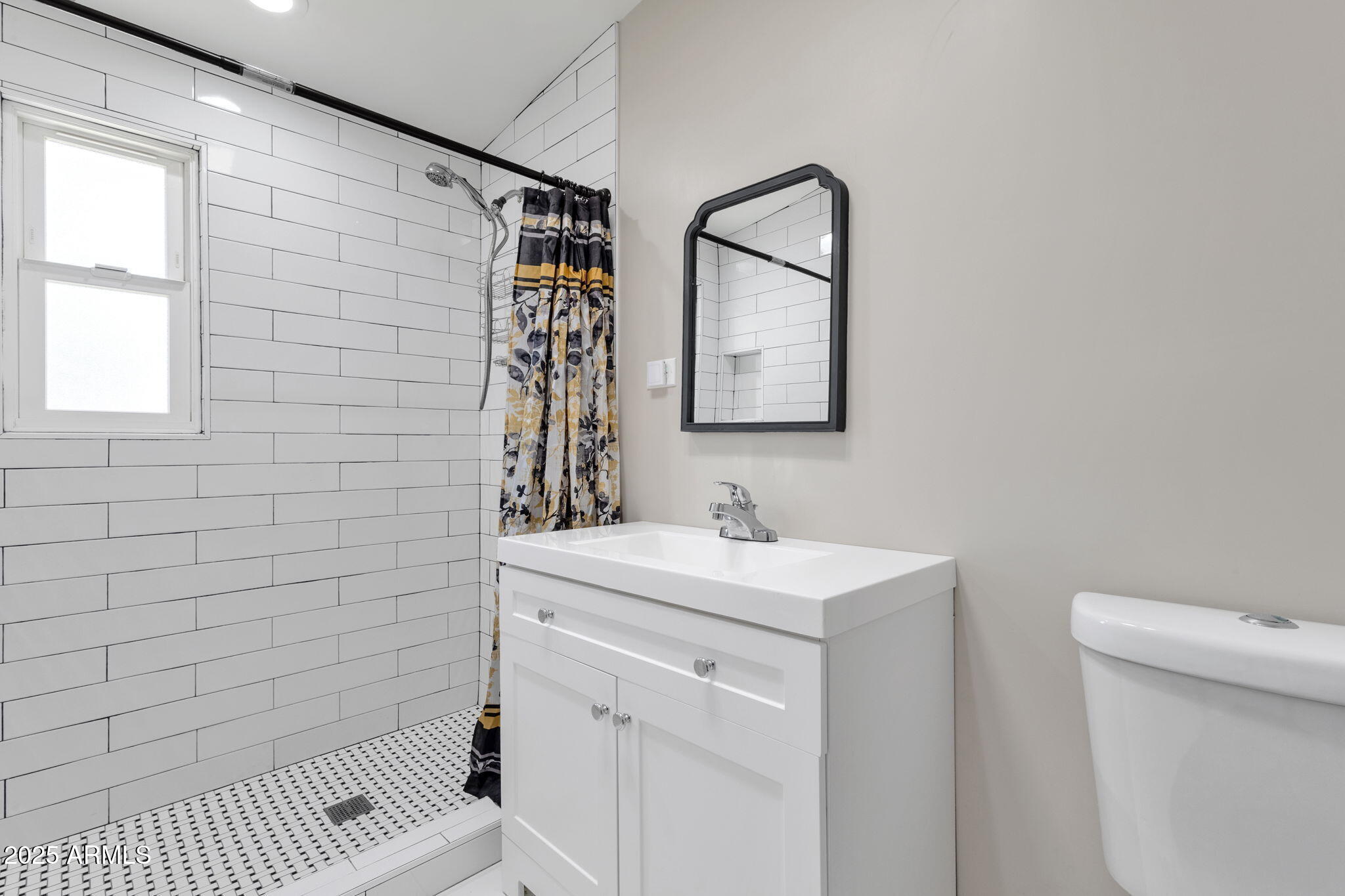 343 West Montecito Avenue Phoenix, AZ 85013 - Photo 6 of 39 a bathroom with a sink a toilet and mirror