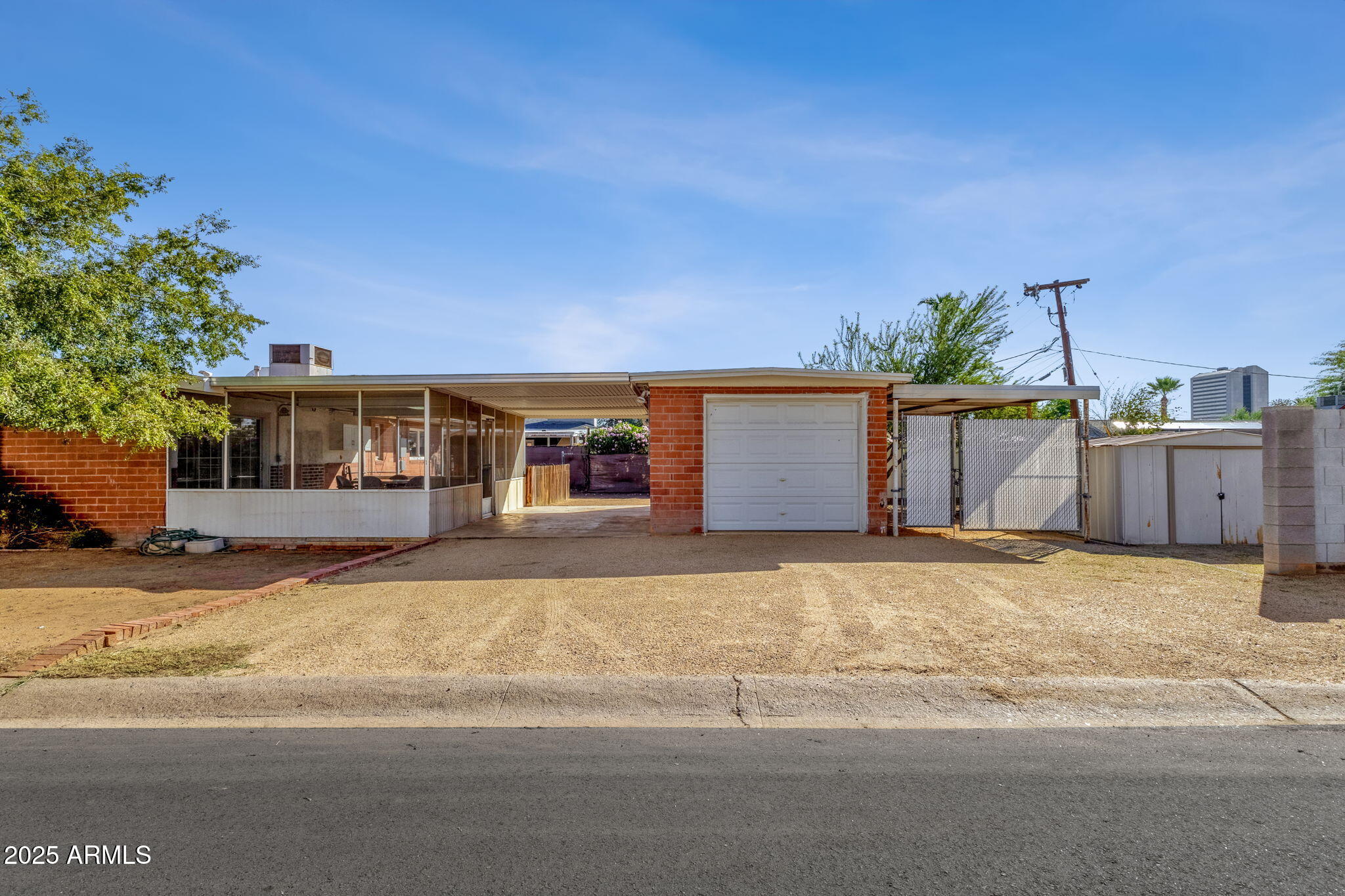 343 West Montecito Avenue Phoenix, AZ 85013 - Photo 7 of 39 a front view of a house with a yard and garage