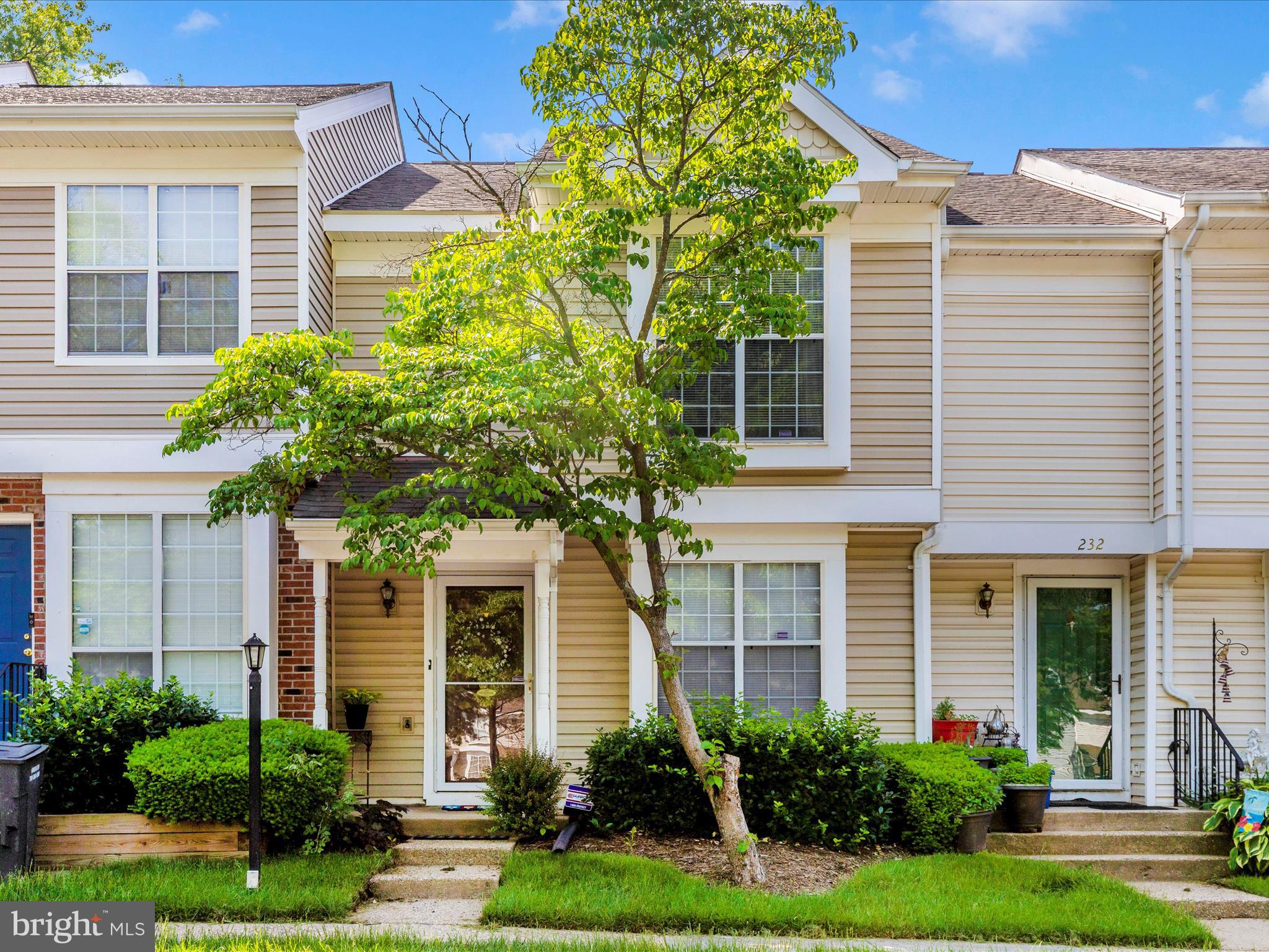 front view of a house and a yard