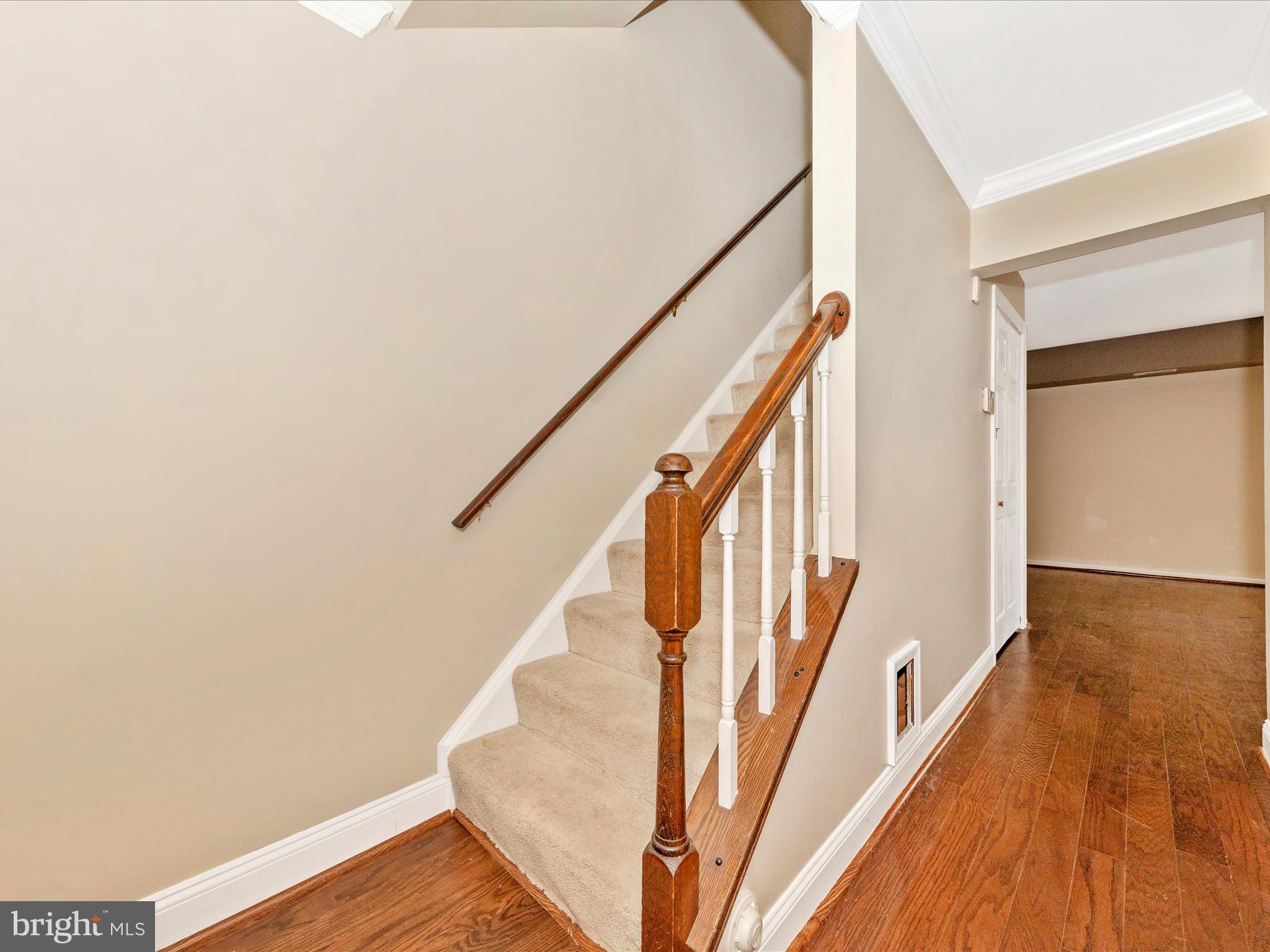 231 Coventry Square, Unit 231 Sterling, VA 20164 - Photo 16 of 40 a view of an entryway with wooden floor