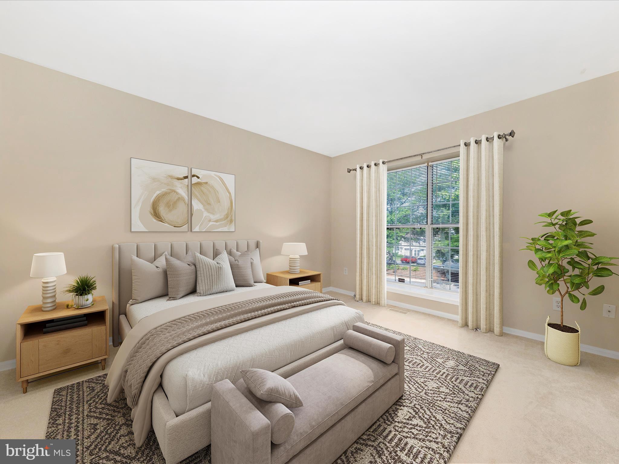 231 Coventry Square, Unit 231 Sterling, VA 20164 - Photo 23 of 40 a bedroom with a large bed and a potted plant