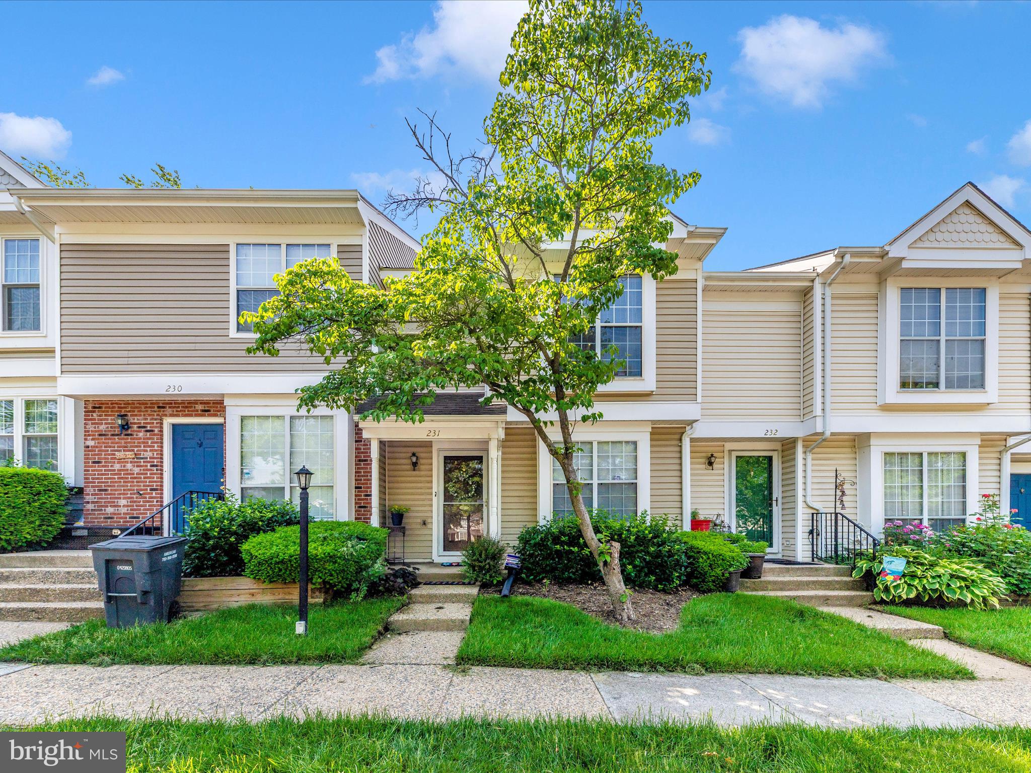 231 Coventry Square, Unit 231 Sterling, VA 20164 - Photo 30 of 40 a front view of a residential houses with yard and green space