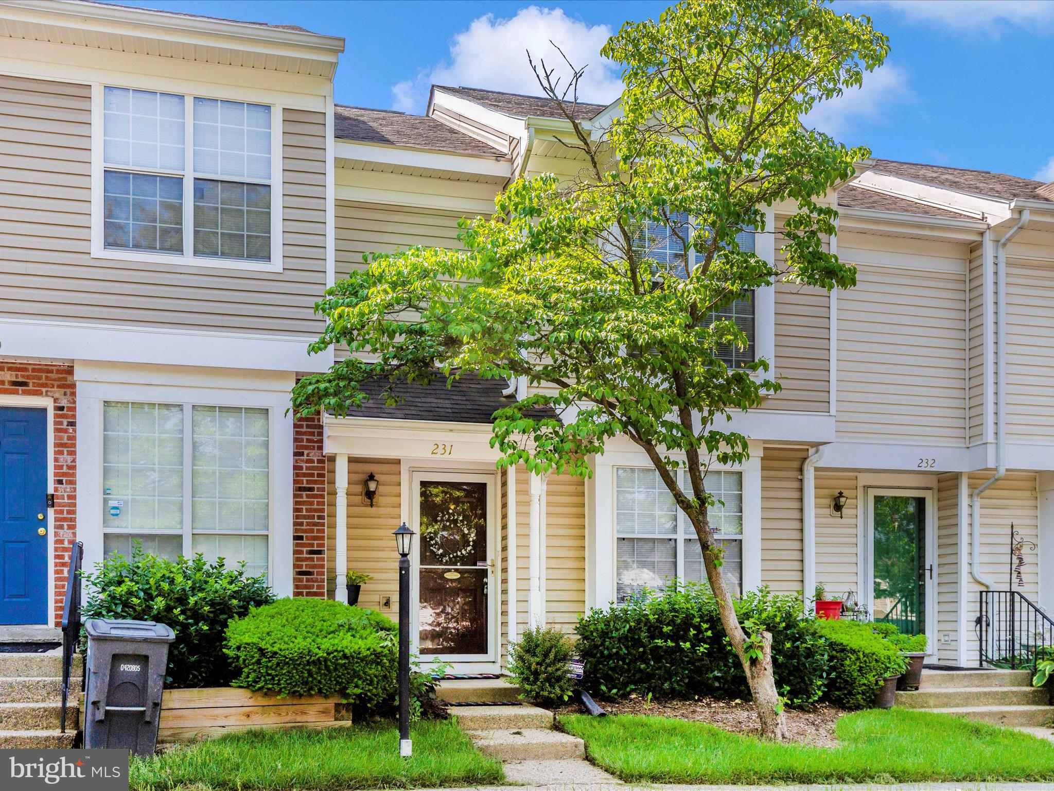231 Coventry Square, Unit 231 Sterling, VA 20164 - Photo 33 of 40 a house that has a tree in front of the house