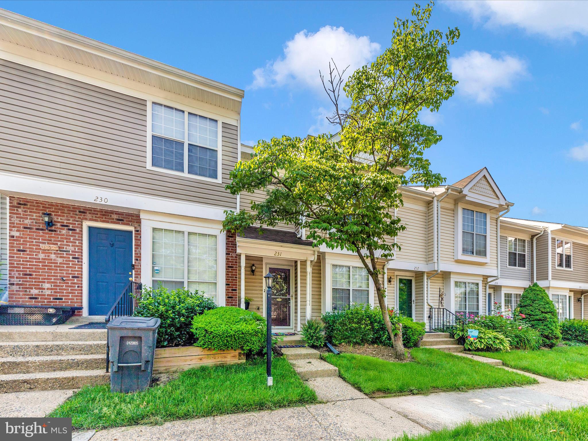 231 Coventry Square, Unit 231 Sterling, VA 20164 - Photo 34 of 40 a front view of a house with garden and trees