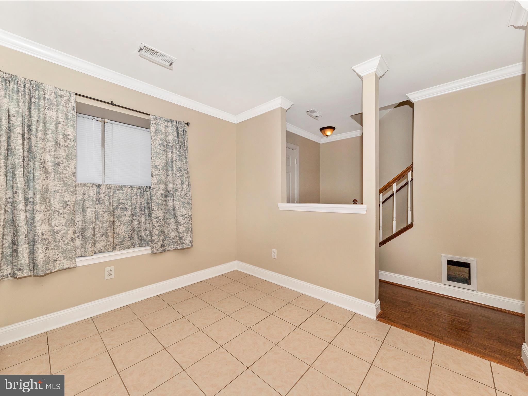 231 Coventry Square, Unit 231 Sterling, VA 20164 - Photo 8 of 40 a view of an empty room with window and cabinet
