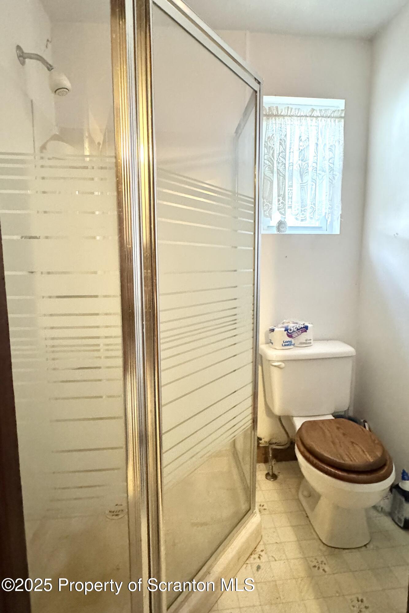 413 Powell Avenue Clarks Summit, PA 18411 - Photo 11 of 31 a bathroom with a toilet and a shower