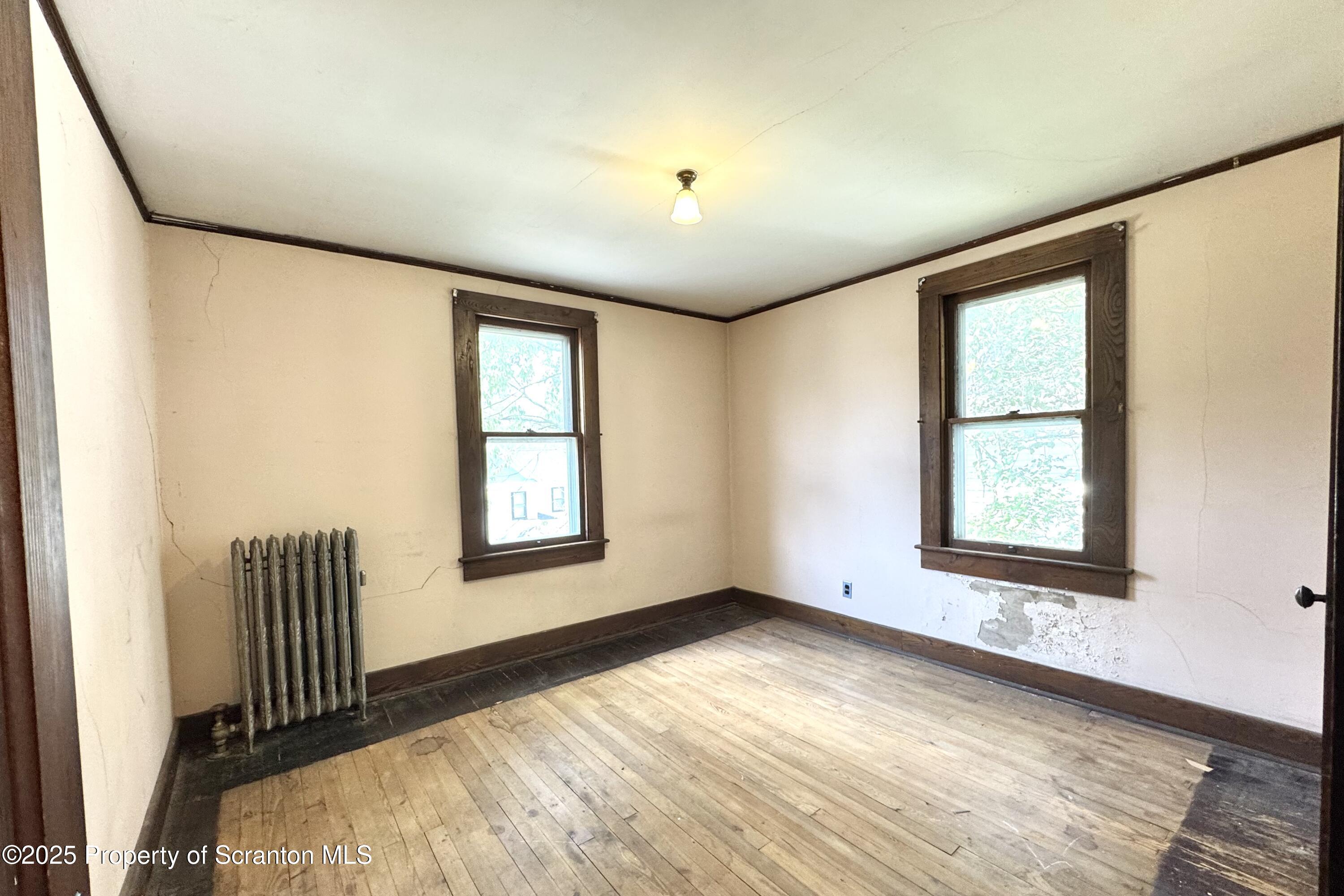 413 Powell Avenue Clarks Summit, PA 18411 - Photo 12 of 31 a view of an empty room with a window