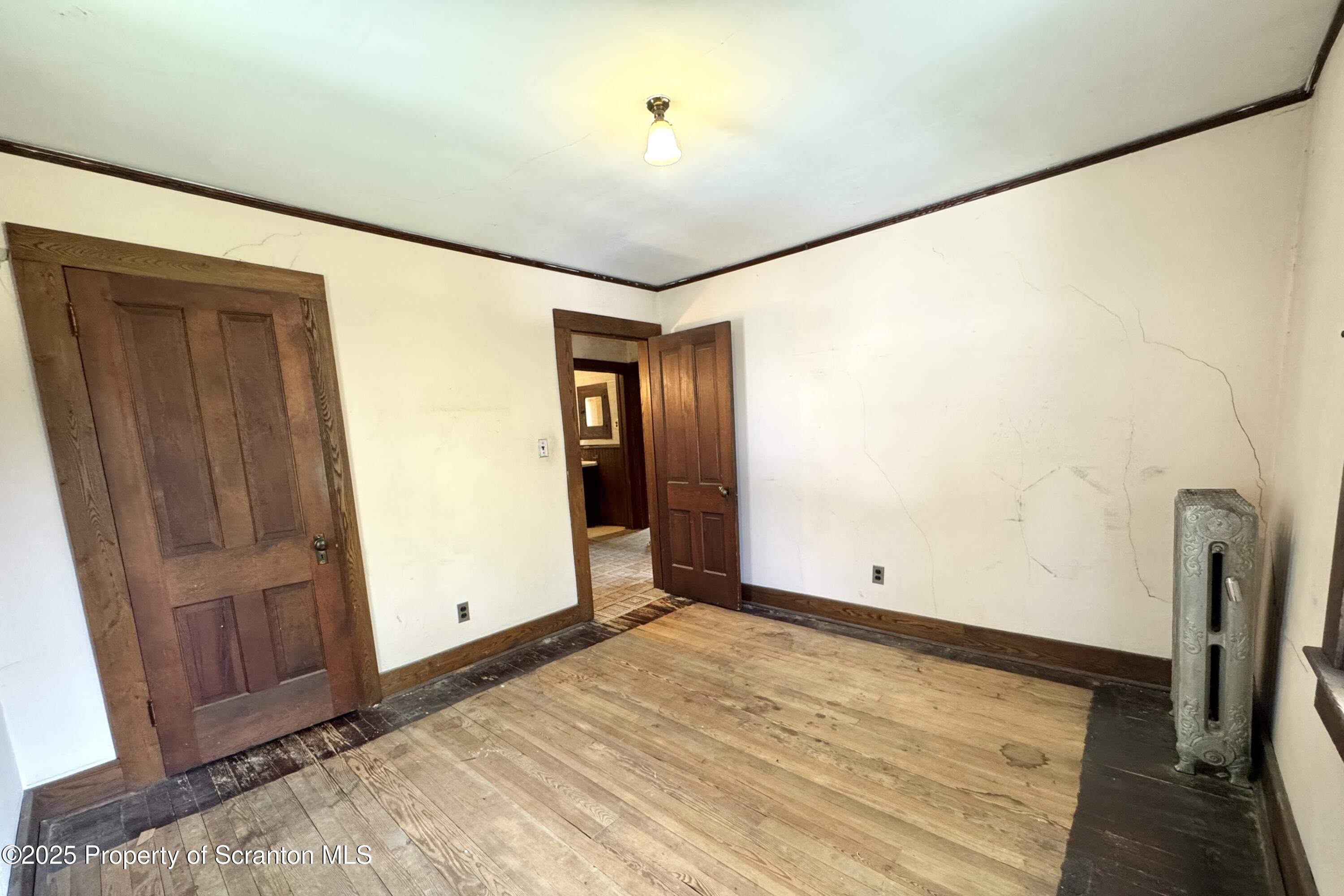 413 Powell Avenue Clarks Summit, PA 18411 - Photo 13 of 31 a view of empty room with wooden floor