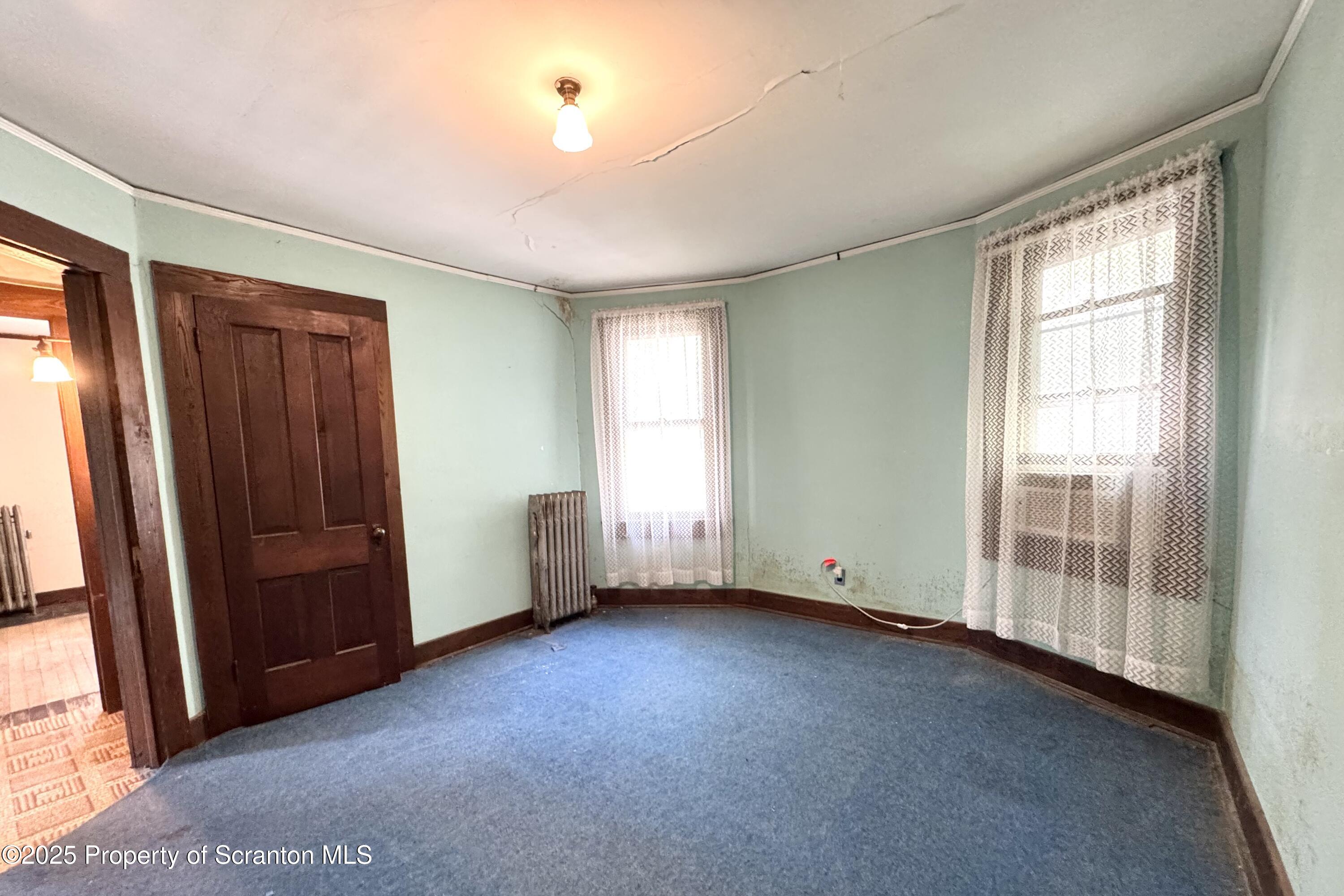 413 Powell Avenue Clarks Summit, PA 18411 - Photo 16 of 31 an empty room with windows