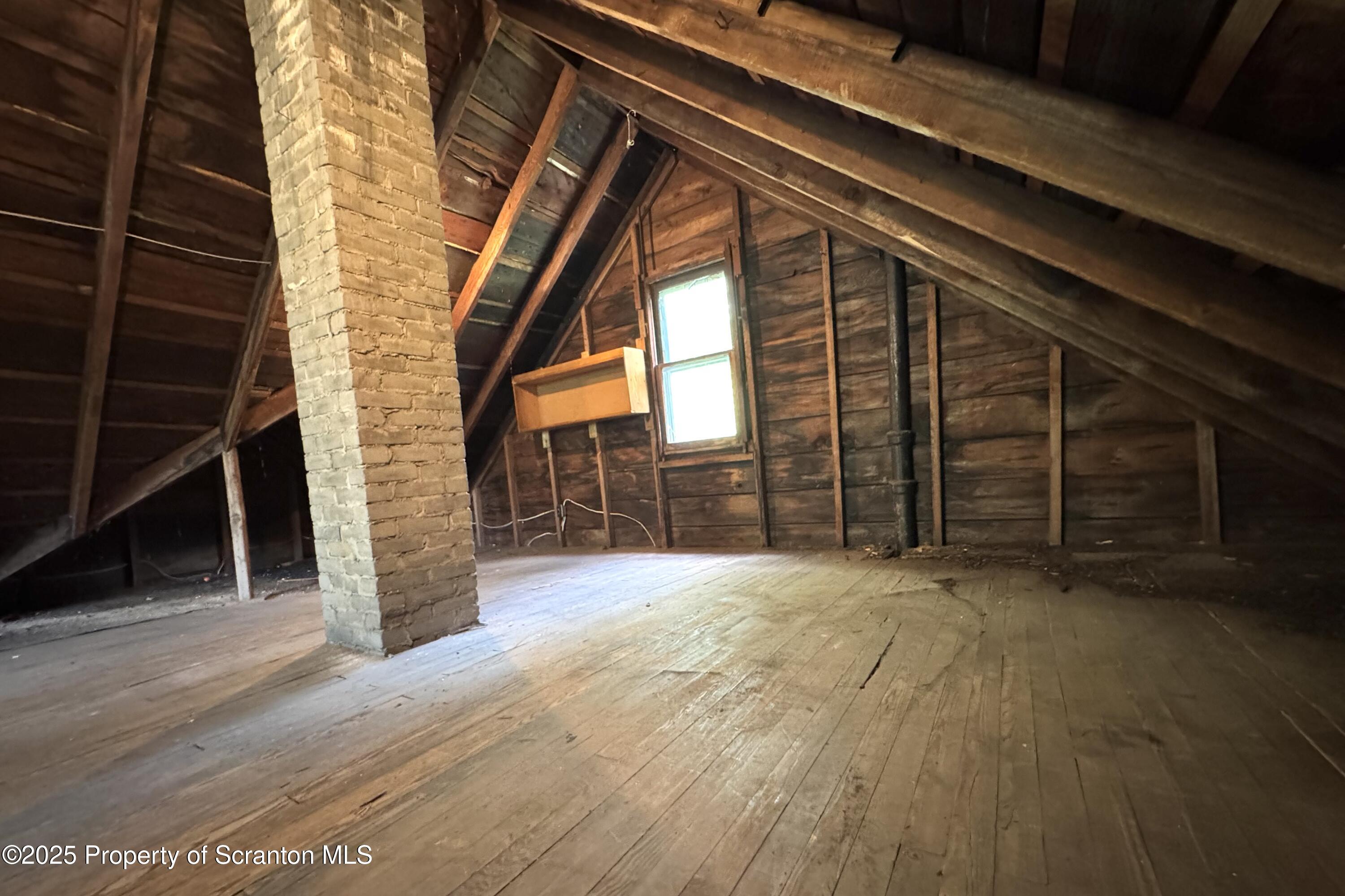 413 Powell Avenue Clarks Summit, PA 18411 - Photo 23 of 31 a view of an empty room with wooden floor and windows