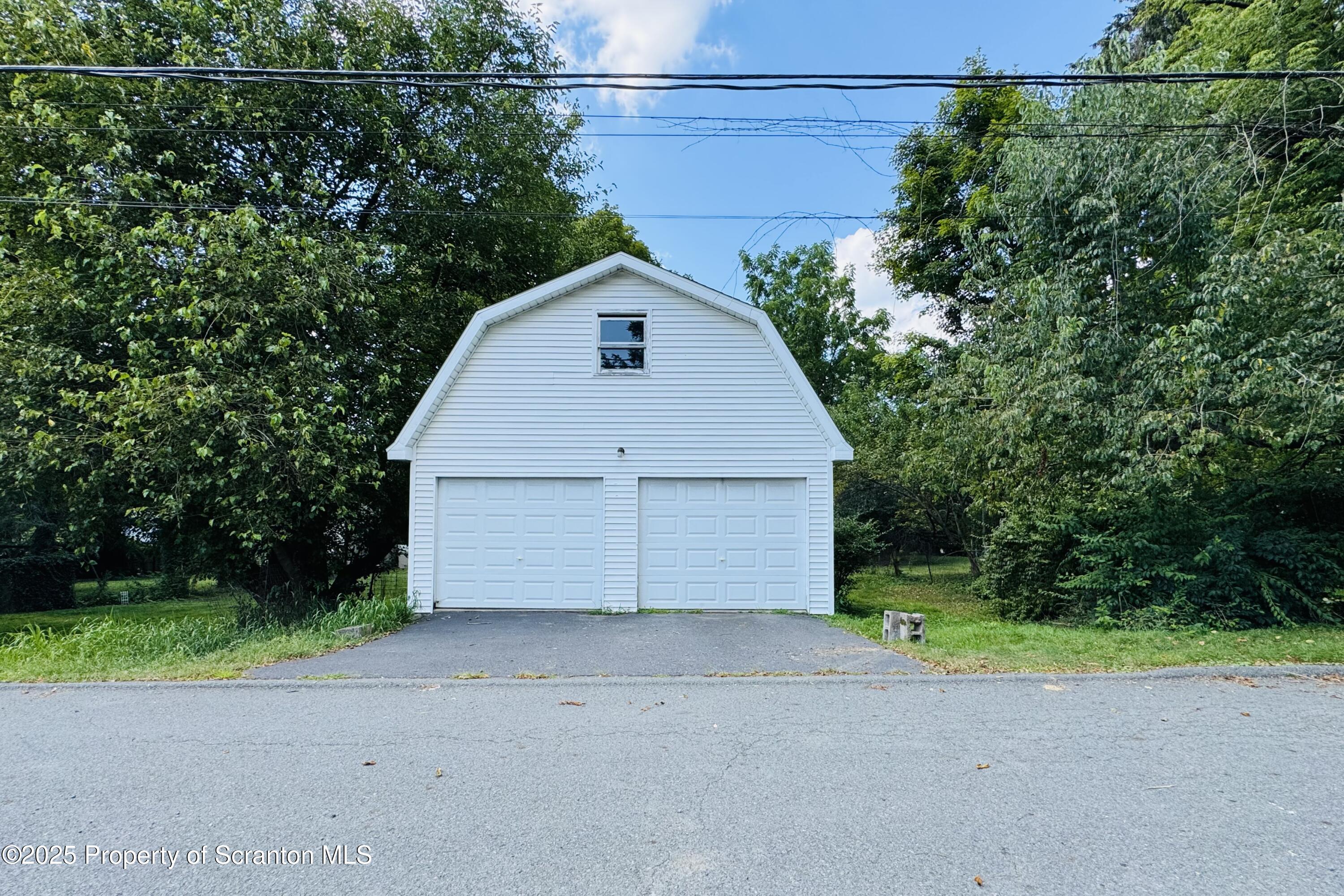 413 Powell Avenue Clarks Summit, PA 18411 - Photo 25 of 31 a view of a garage with a small yard