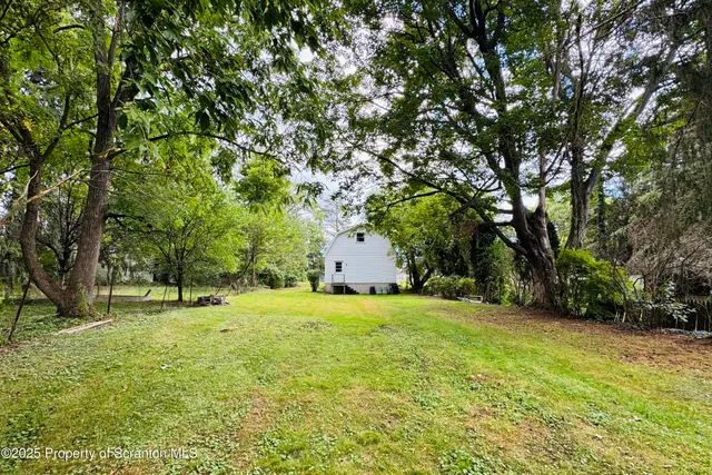 a house with trees in the background