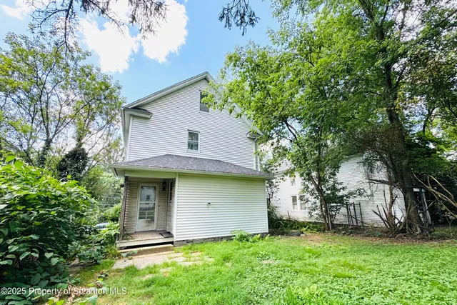 a view of a backyard of the house