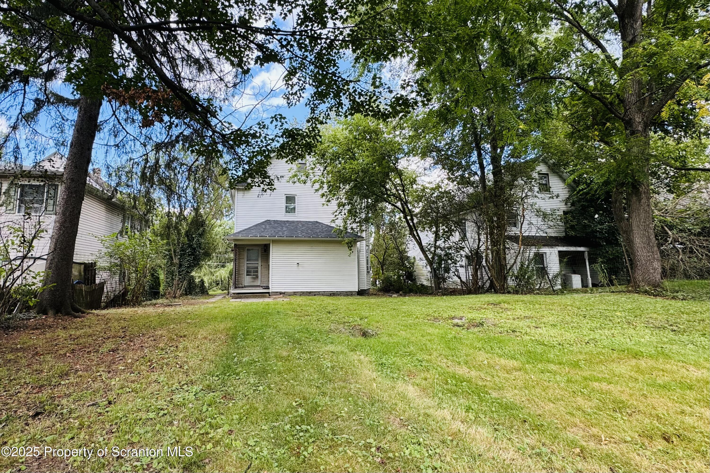 413 Powell Avenue Clarks Summit, PA 18411 - Photo 30 of 31 a house with trees in front of it