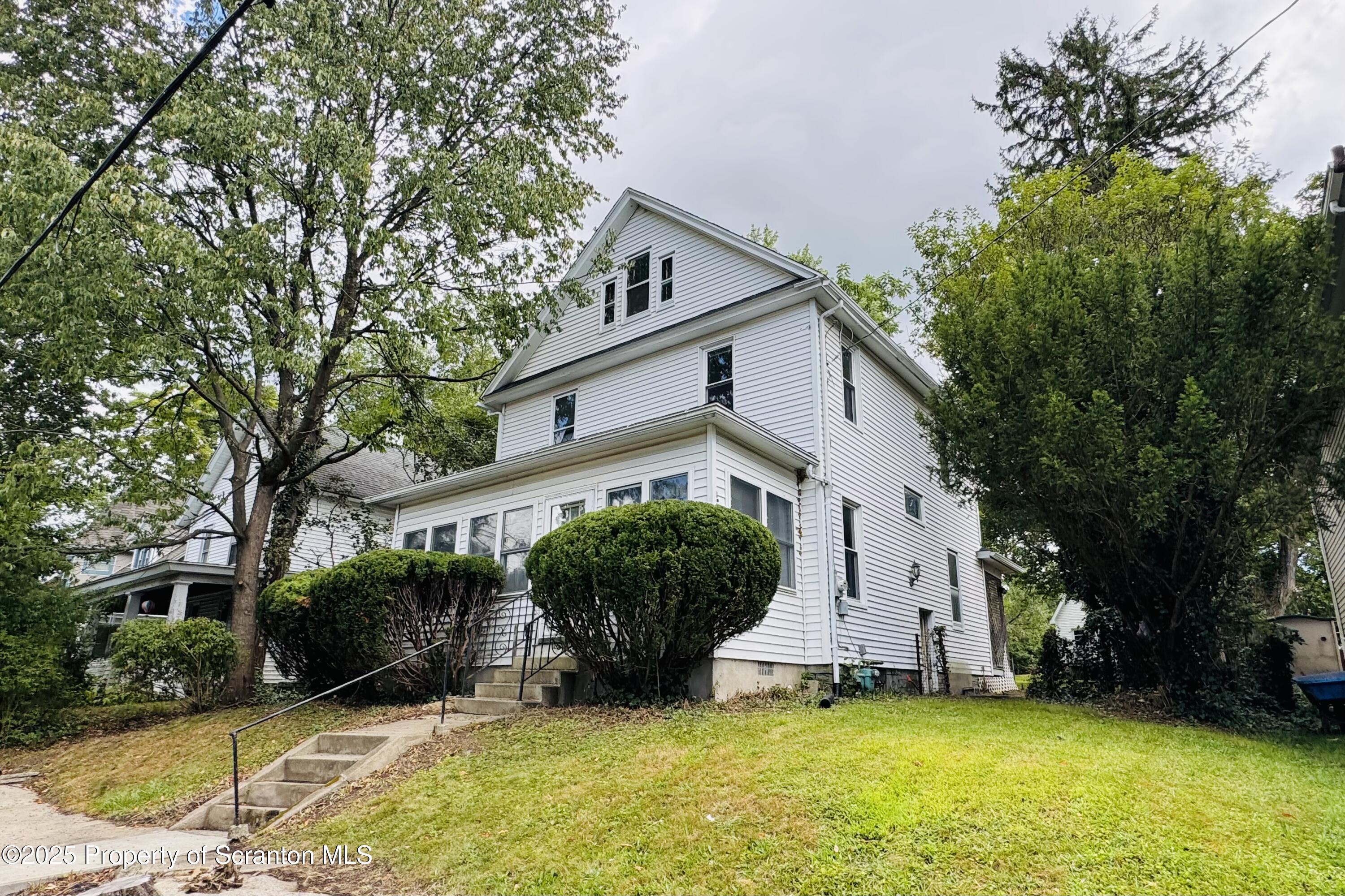 413 Powell Avenue Clarks Summit, PA 18411 - Photo 3 of 31 a view of a house with a yard and large tree