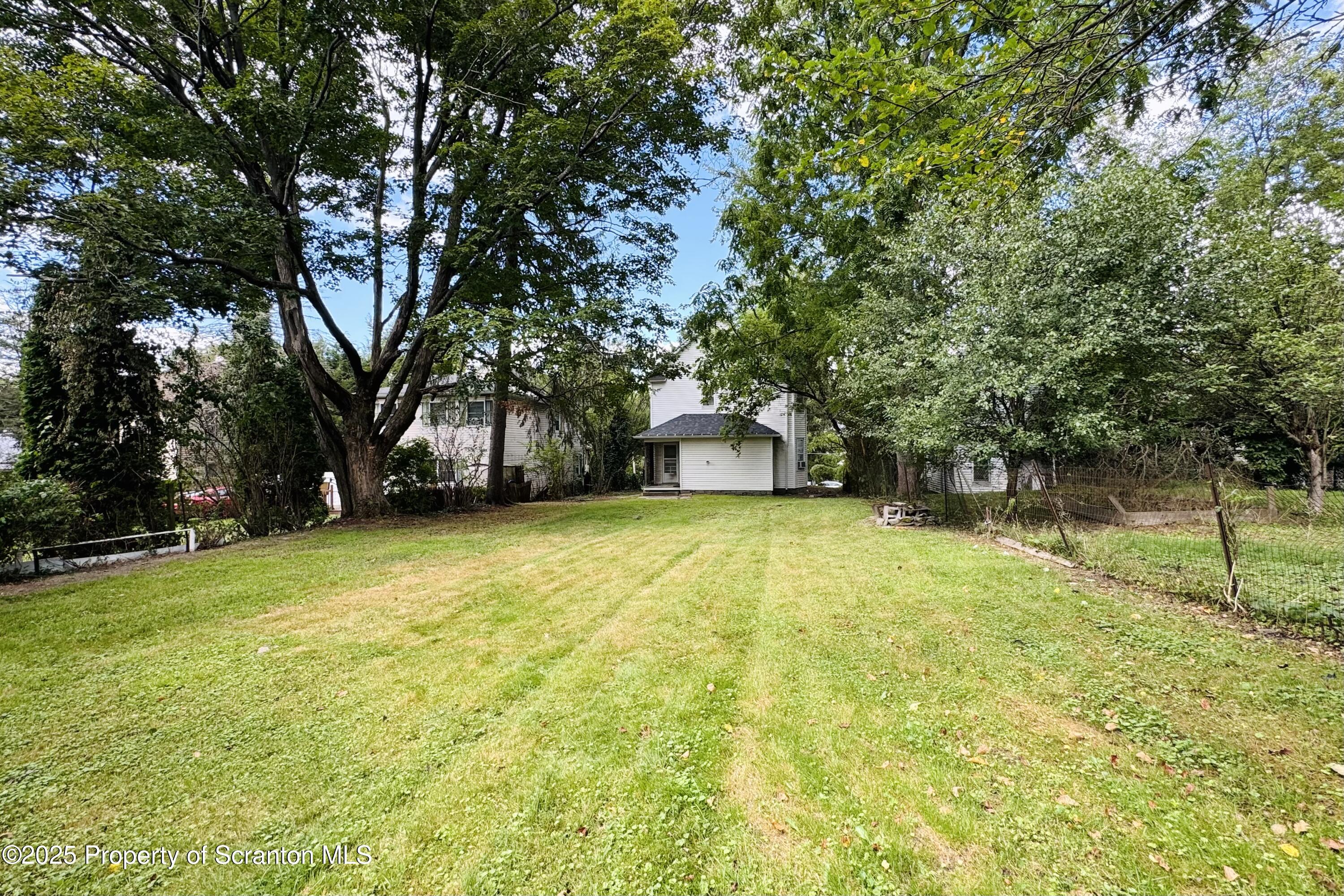 413 Powell Avenue Clarks Summit, PA 18411 - Photo 31 of 31 a swimming pool with trees in the background