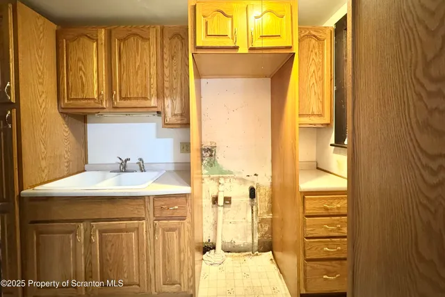a bathroom with a sink a mirror and a shower