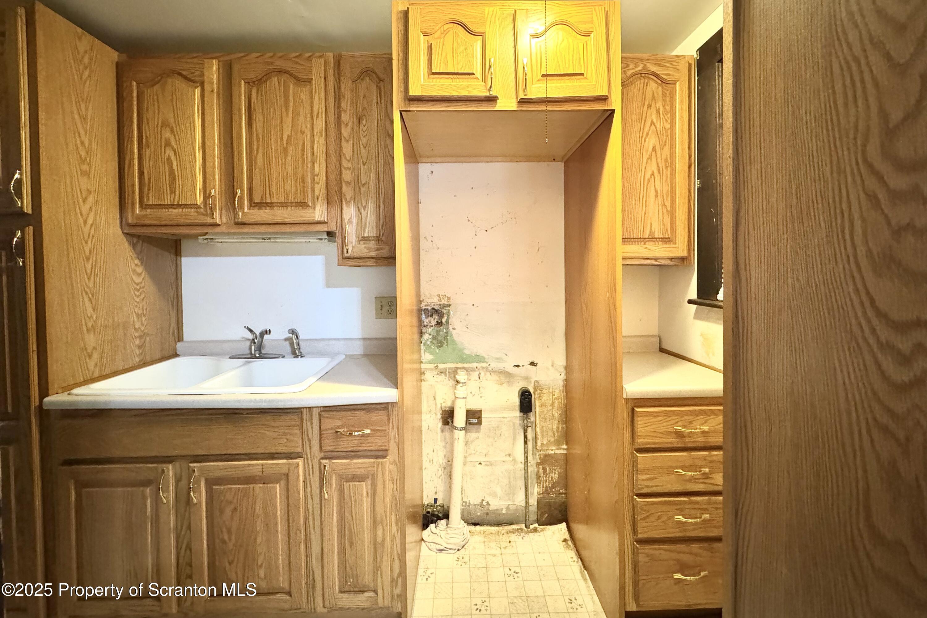413 Powell Avenue Clarks Summit, PA 18411 - Photo 8 of 31 a bathroom with a sink a mirror and a shower