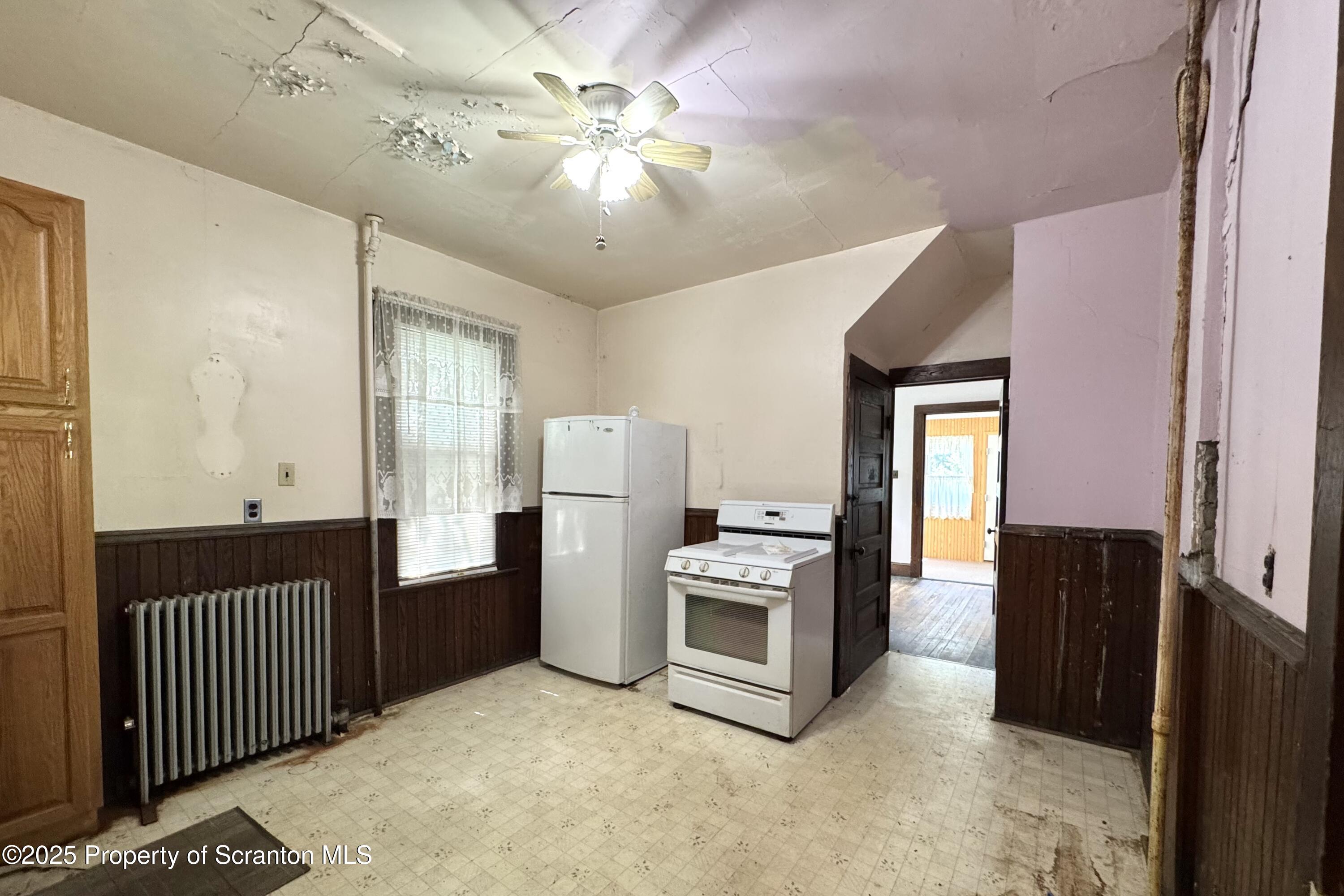 413 Powell Avenue Clarks Summit, PA 18411 - Photo 9 of 31 a view of kitchen with refrigerator cabinets and furniture