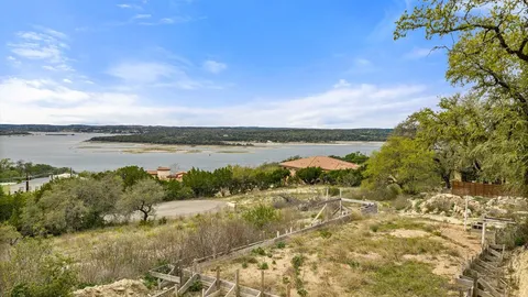 a view of a lake with houses in the background