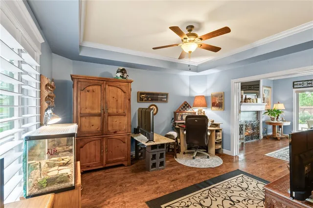 a room with furniture a clock and a window