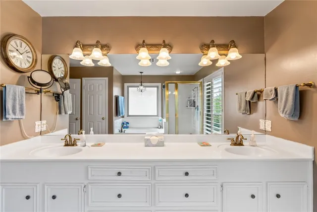 a bathroom with a sink vanity and a mirror