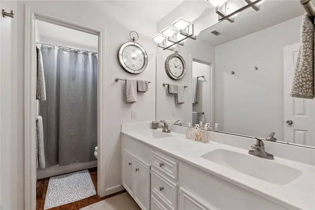 a bathroom with a sink and a large mirror