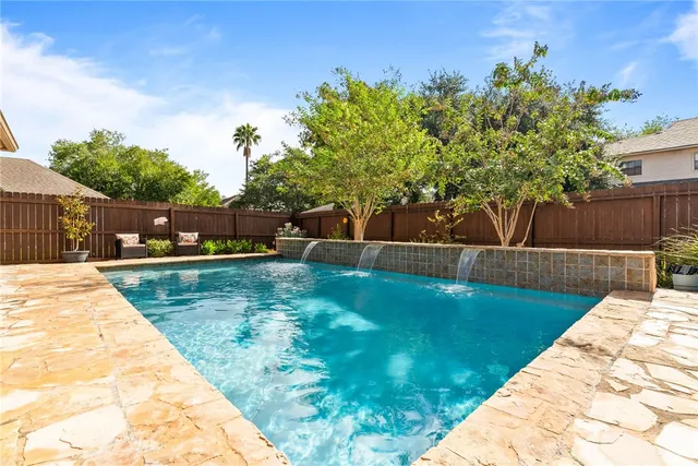 a view of a backyard with a garden