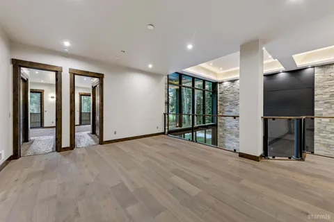 a spacious bathroom with a granite countertop sink and a large mirror