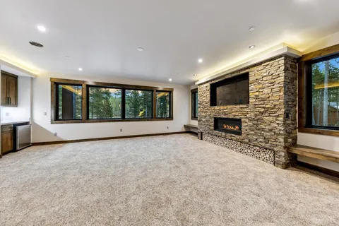 a bathroom with a double vanity sink a mirror and a shower