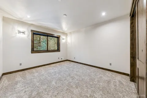 a bathroom with a sink a shower and a mirror