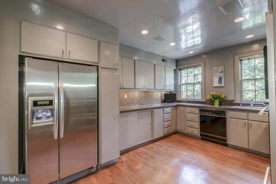 2810 R Street Northwest Washington, DC 20007 - Photo 5 of 14 a kitchen with a refrigerator sink and cabinets