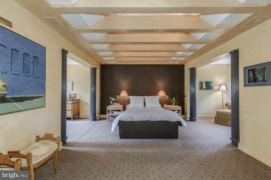 2810 R Street Northwest Washington, DC 20007 - Photo 7 of 14 a bedroom with a large bed and a chair