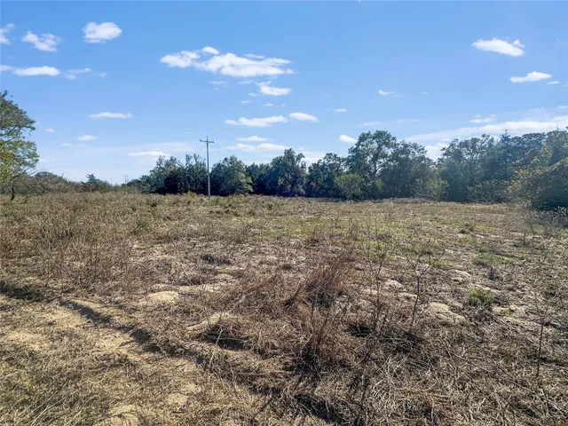a view of a swimming pool with an outdoor space and seating area
