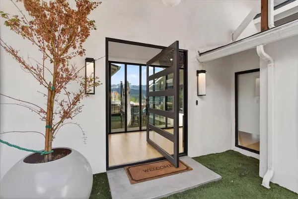 a bedroom with a large bed and a couch