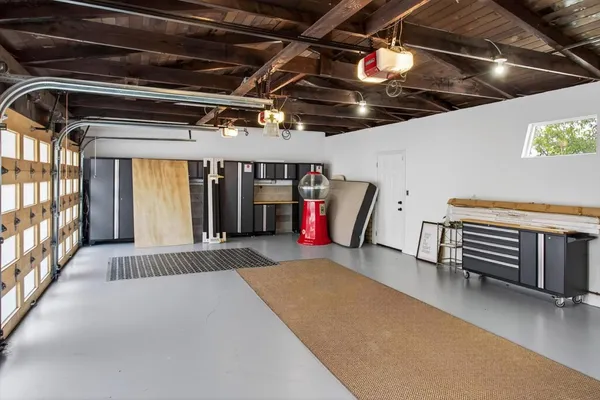 a bathroom with a granite countertop sink a toilet and shower