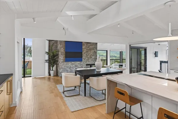 a bedroom with a large bed and a couch