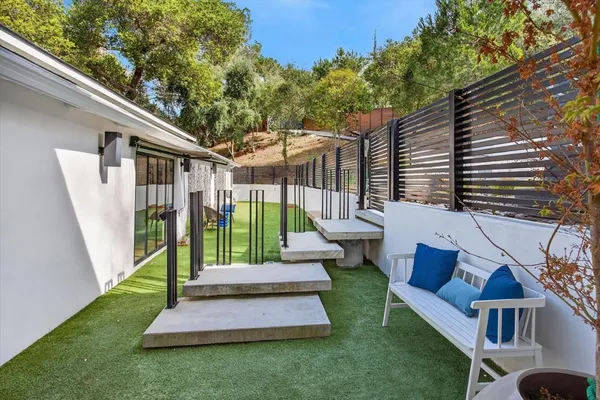 a view of a house with backyard and porch