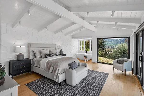 a bathroom with a granite countertop sink a toilet and shower