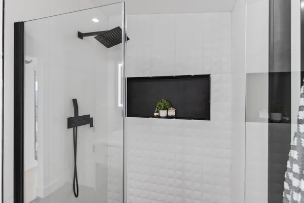 a kitchen with stainless steel appliances a refrigerator and a stove top oven