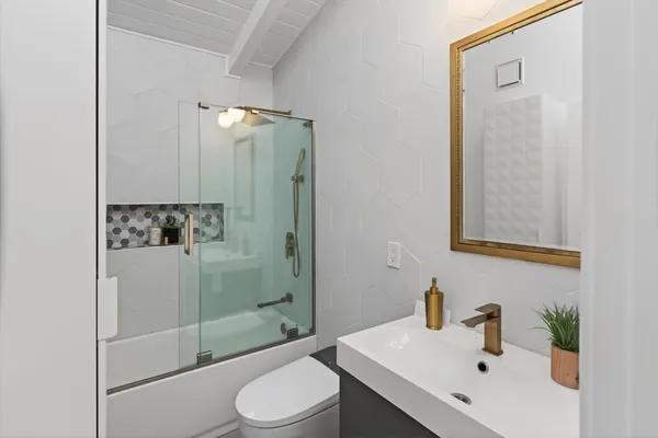 a bedroom with a bed and a walk in closet