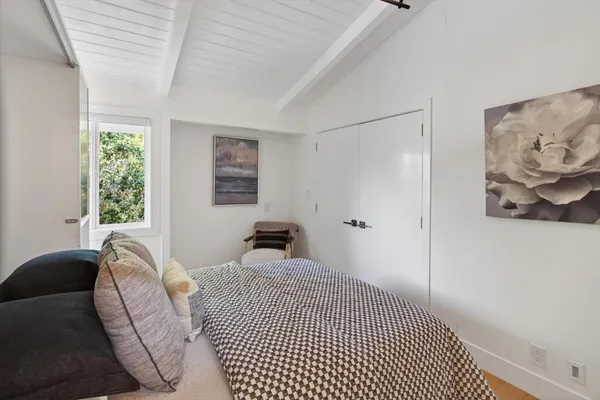 a view of a deck with two chair and a potted plant