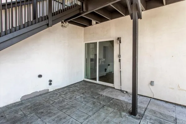 a view of a terrace with couches and sky view