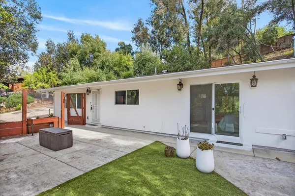 a view of a backyard with tree s