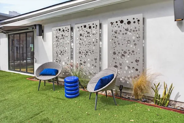 an aerial view of residential houses with outdoor space