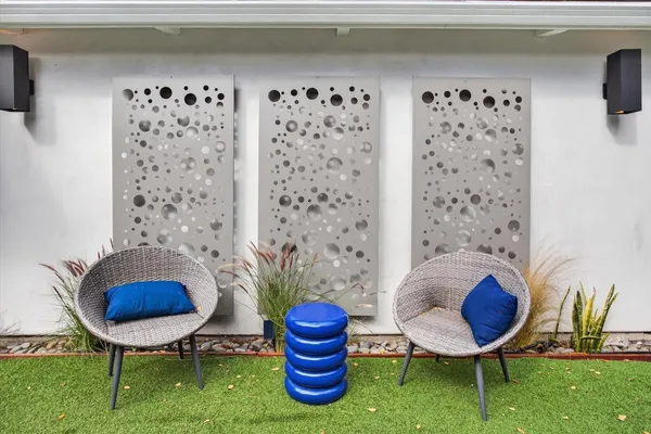 an aerial view of a house with a yard and lake view